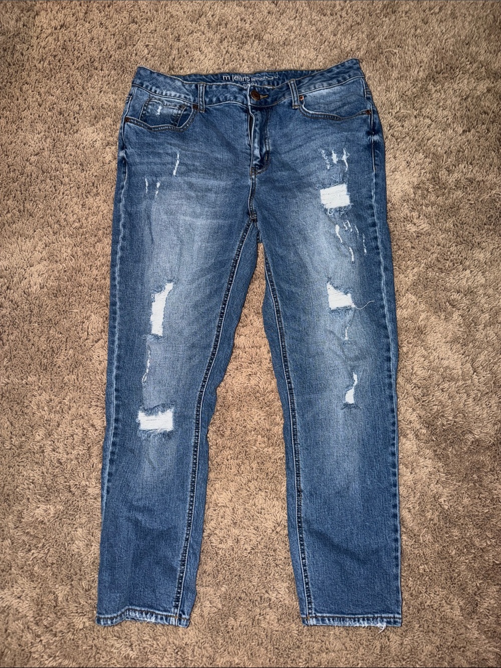 Woman’s mid rise ripped jeans